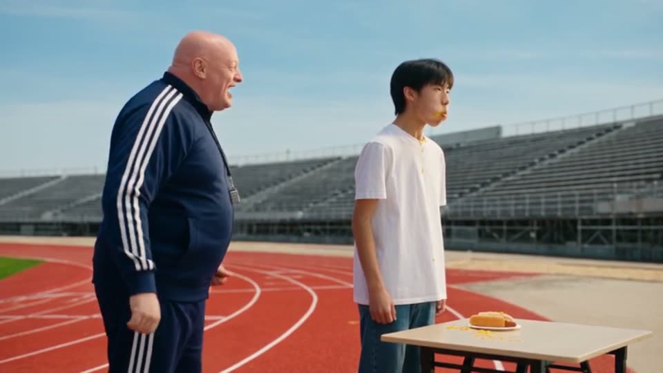 Clip 5: Mike and his bald coach on a red running track